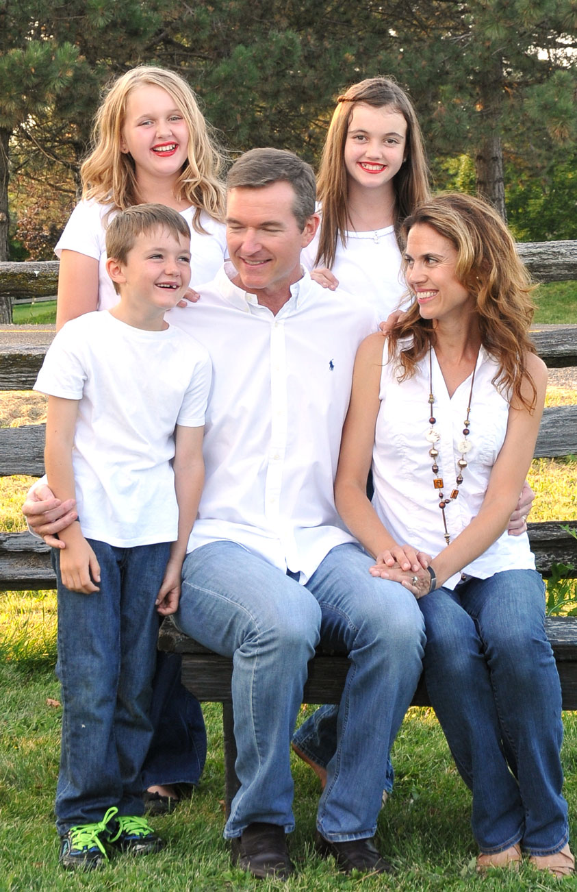 family posing outdoors