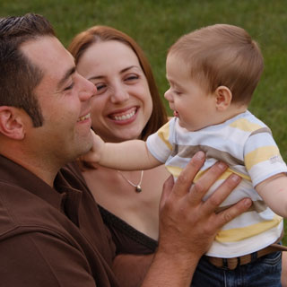 Parents and baby outside