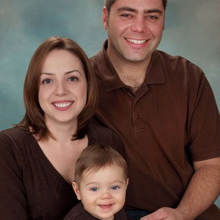 Parents and baby posing in studio