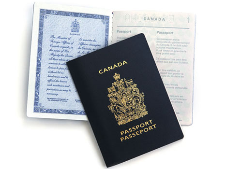 closed passport on top of open passport booklet