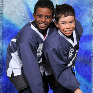 Two boy hockey players posing
